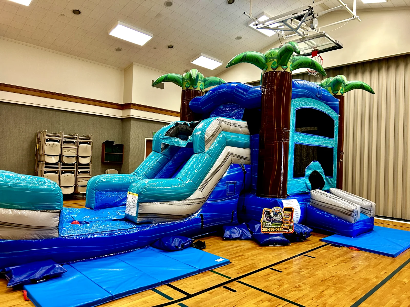 Salty Air inflatable set up indoors in a church gym